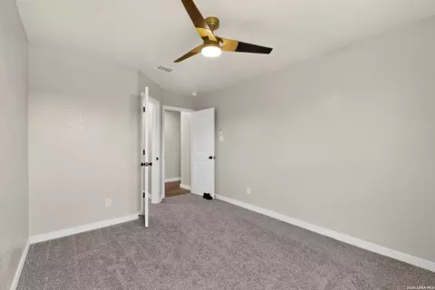 Bedroom - 15018 Silver Tree Cv, Von Ormy, TX 78073 photo 8 of 10