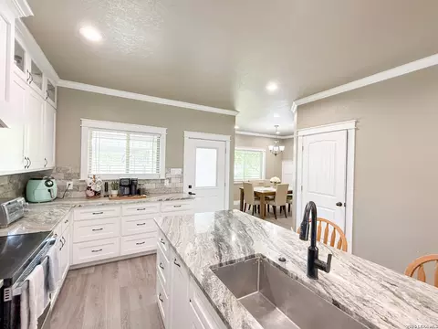 Kitchen - 300 Bluebonnet Ave, Devine, TX 78016 photo 2 of 3
