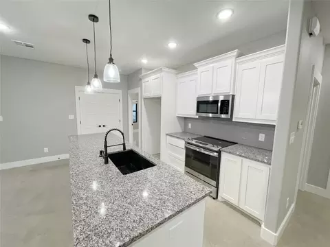 Kitchen - 122 E Harrison St, Denison, TX 75021 photo 2 of 6