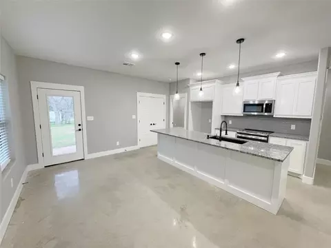 Kitchen - 122 E Harrison St, Denison, TX 75021 photo 1 of 6