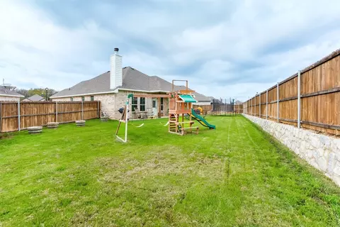 Exterior - 311 Bronco Dr, Pilot Point, TX 76258 photo 3 of 7