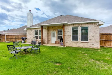 Exterior - 311 Bronco Dr, Pilot Point, TX 76258 photo 4 of 7