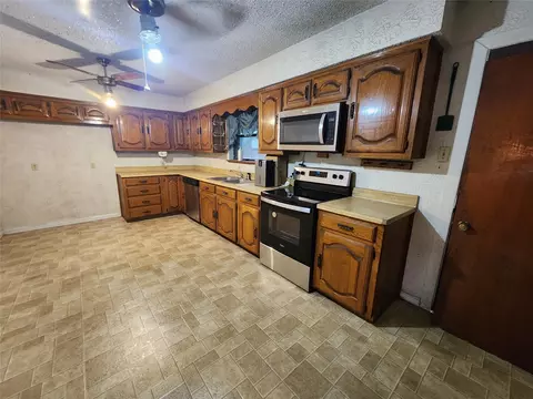 Kitchen - 209 E 2nd St, Quinlan, TX 75474 photo 1 of 2