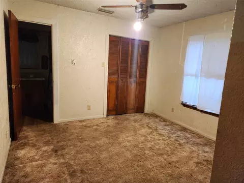 Bedroom - 209 E 2nd St, Quinlan, TX 75474 photo 2 of 4