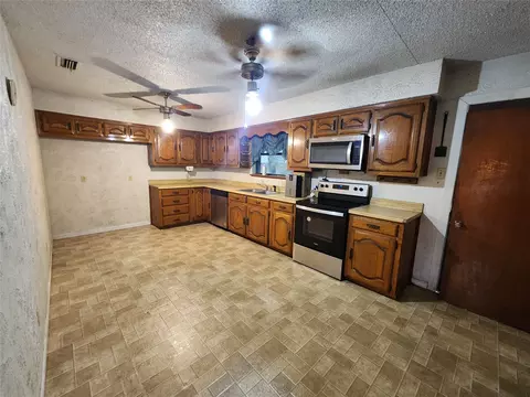 Kitchen - 209 E 2nd St, Quinlan, TX 75474 photo 2 of 2