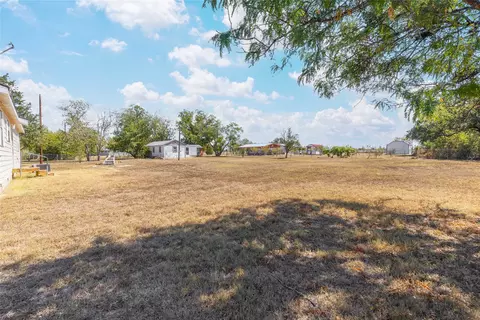 Exterior - 401 E Goodwin St, Bangs, TX 76823 photo 11 of 16
