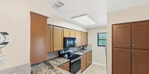 Kitchen - 3037 Hells Gate Loop #C208, Strawn, TX 76475 photo 2 of 3
