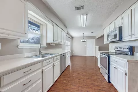 Kitchen - 301 Pecan St, Tom Bean, TX 75489 photo 2 of 2