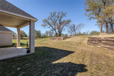 Exterior - 1041 Tex Ln, Springtown, TX 76082 photo 7 of 8