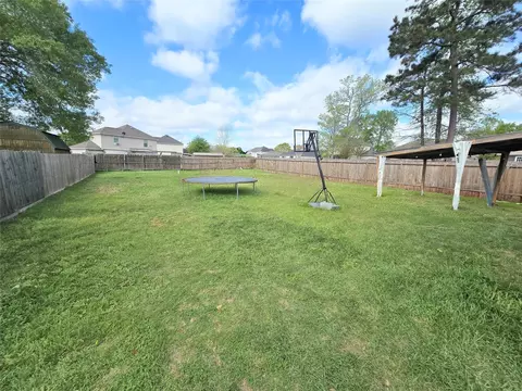 Exterior - 8853 E Buffalo Cir, Willis, TX 77378 photo 4 of 7
