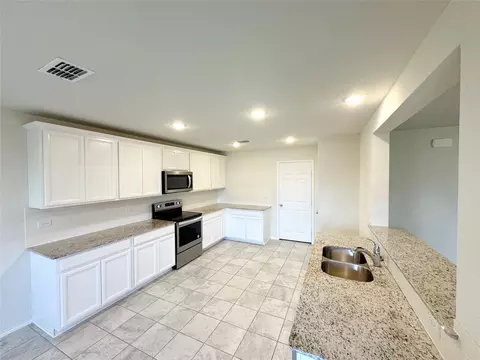 Kitchen - 1715 Ackerly Dr, Forney, TX 75126 photo 2 of 3