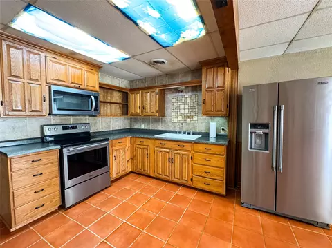 Kitchen - 705 N Avenue E, Haskell, TX 79521 photo 2 of 3