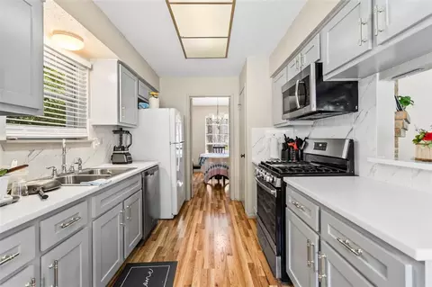 Kitchen - 1 E Woodtimber Ct, Spring, TX 77381 photo 2 of 2