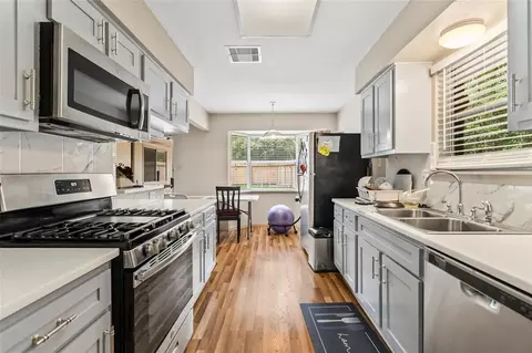 Kitchen - 1 E Woodtimber Ct, Spring, TX 77381 photo 1 of 2
