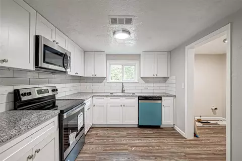 Kitchen - 10694 Pine St, Willis, TX 77318 photo 2 of 4