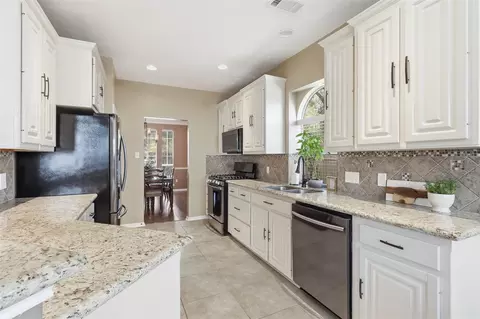 Kitchen - 12010 Audrey Ct, Pinehurst, TX 77362 photo 2 of 2