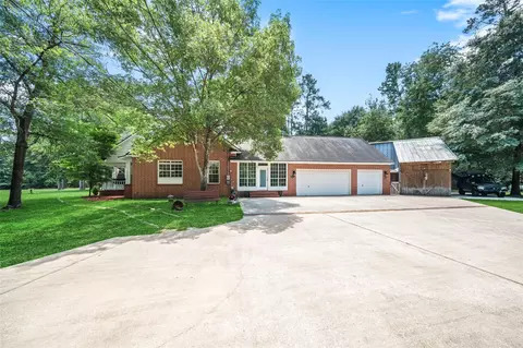 Exterior - 403 Westbrook St, Pinehurst, TX 77362 photo 14 of 16