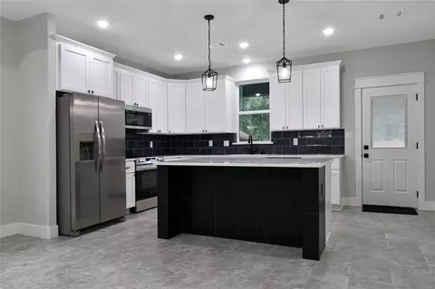 Kitchen - 14833 Pine Dr, Conroe, TX 77302 photo 1 of 2