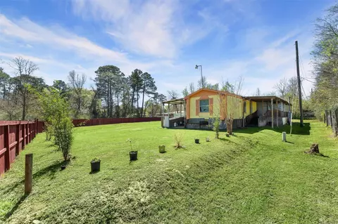 Exterior - 606 S Pine Hill St, Pinehurst, TX 77362 photo 4 of 6