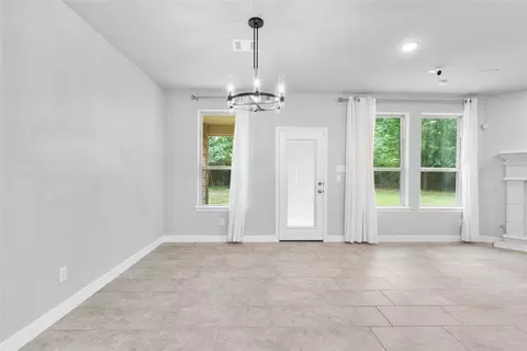 Living - 135 Teralyn Grove Loop, Willis, TX 77318 photo 2 of 4
