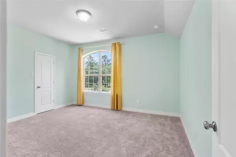 Bedroom - 135 Teralyn Grove Loop, Willis, TX 77318 photo 8 of 10