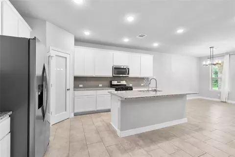 Kitchen - 135 Teralyn Grove Loop, Willis, TX 77318 photo 2 of 3