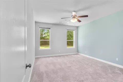 Bedroom - 135 Teralyn Grove Loop, Willis, TX 77318 photo 2 of 10