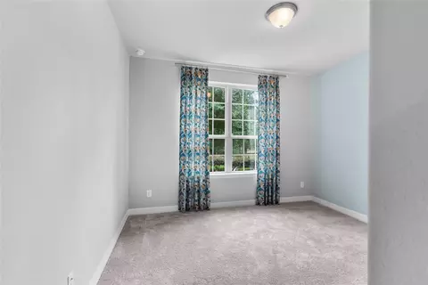 Bedroom - 135 Teralyn Grove Loop, Willis, TX 77318 photo 4 of 10