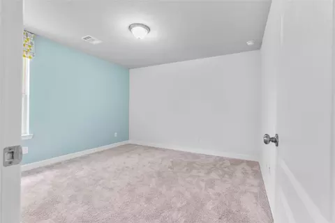 Bedroom - 135 Teralyn Grove Loop, Willis, TX 77318 photo 6 of 10