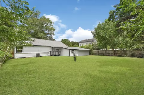 Exterior - 1202 N Roberson St, Conroe, TX 77301 photo 5 of 12