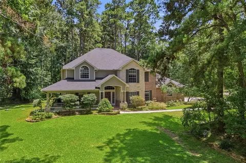 Exterior - 8766 Skyline Ln, Conroe, TX 77302 photo 2 of 9