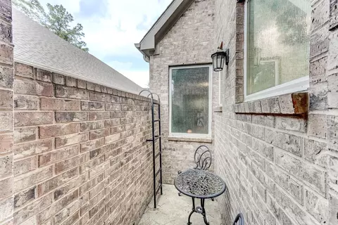 Exterior - 404 Summit Ridge Ct, Willis, TX 77318 photo 5 of 8