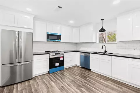 Kitchen - 301 Pineland Dr, Trinity, TX 75862 photo 2 of 3
