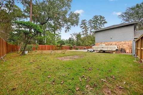 Exterior - 303 Springwood St, New Caney, TX 77357 photo 9 of 15