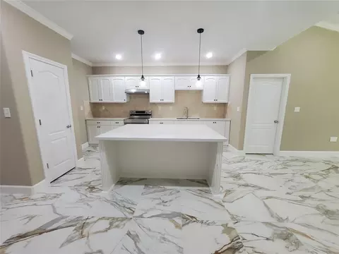 Kitchen - 1306 N 9th St, Conroe, TX 77301 photo 2 of 3