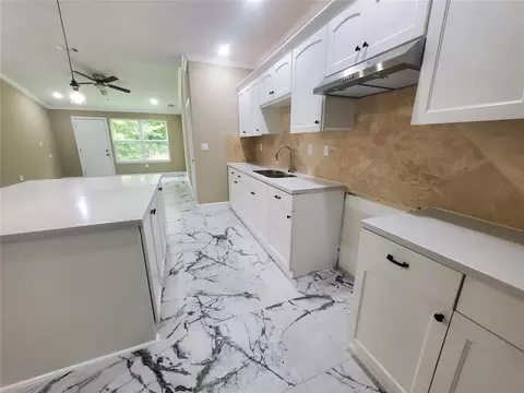 Kitchen - 1306 N 9th St, Conroe, TX 77301 photo 3 of 3