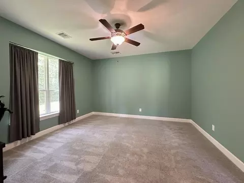 Bedroom - 1145 Goodson Loop, Pinehurst, TX 77362 photo 2 of 8