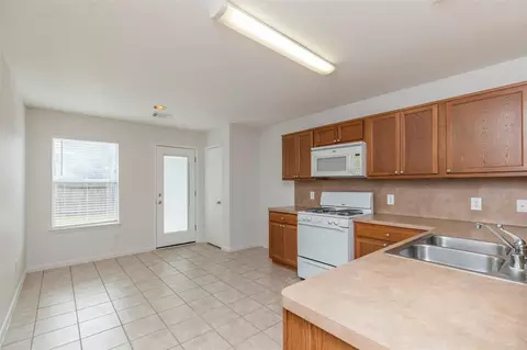 Kitchen - 21202 Fire Wind Ct, Spring, TX 77379 photo 2 of 2