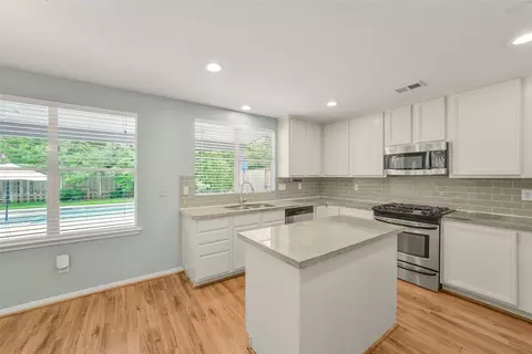 Kitchen - 22 E New Avery Pl, Spring, TX 77382 photo 2 of 4