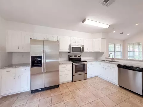 Kitchen - 1119 Coe Rd, Pinehurst, TX 77362 photo 2 of 3