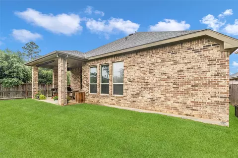 Exterior - 561 Rolling Brook Ln, Pinehurst, TX 77362 photo 3 of 6