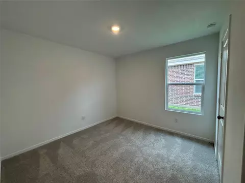 Bedroom - 521 Falling Cave Dr, Willis, TX 77378 photo 2 of 7