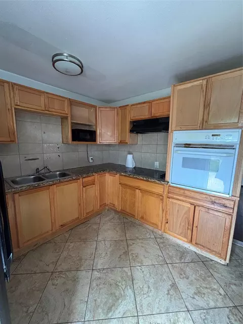 Kitchen - 828 N Chenango St, Angleton, TX 77515 photo 2 of 3