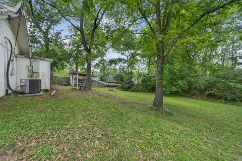 Exterior - 15185 Travis Ln, Willis, TX 77378 photo 4 of 12