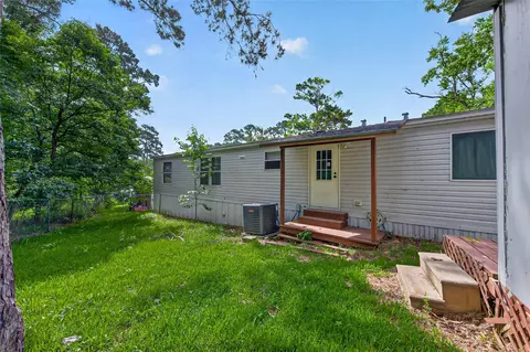 Exterior - 121 E Oak Shadows, Onalaska, TX 77360 photo 10 of 12