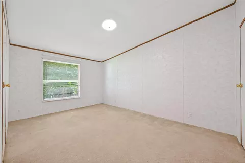 Bedroom - 121 E Oak Shadows, Onalaska, TX 77360 photo 4 of 5