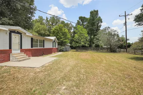Exterior - 14985 Wiggins Rd, Conroe, TX 77302 photo 3 of 12