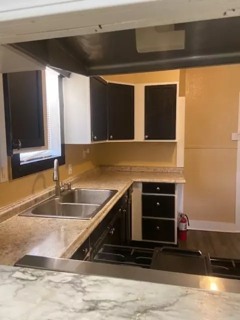 Kitchen - 214 S Hackberry Ave, Luling, TX 78648 photo 1 of 4