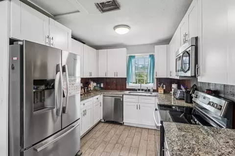 Kitchen - 606 E Pecan St, Taylor, TX 76574 photo 1 of 2