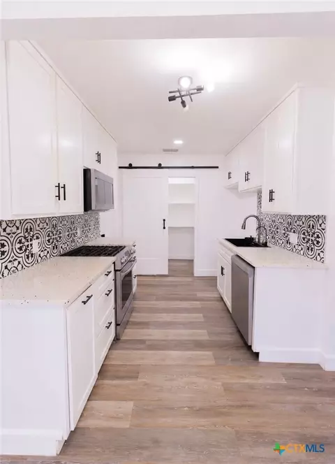 Kitchen - 310 E Second St, Cuero, TX 77954 photo 1 of 2